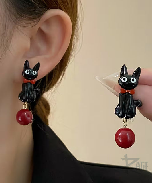 2x Aretes de Gato Negro con perla roja